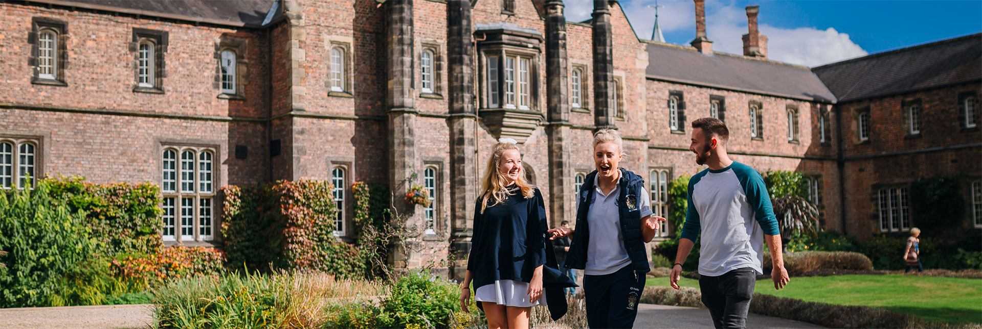 Students walking through the grounds of York St John University campus
